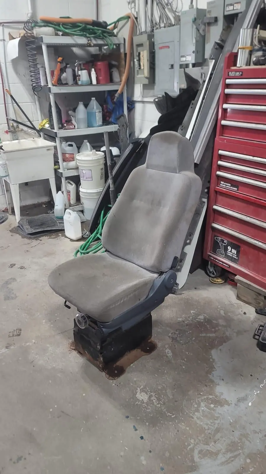 Truck cab restoration, before: worn driver seat